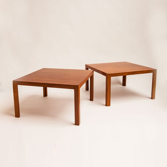 A pair of square coffee tables